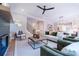 Spacious open-concept living area showcasing a fireplace, staircase, and seamless flow into the kitchen and dining area at 1702 Eastside Parc St, Atlanta, GA 30316