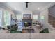 Comfortable living room with fireplace, built-in shelves, and staircase at 1702 Eastside Parc St, Atlanta, GA 30316