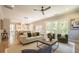 Open-concept living space with a comfortable seating arrangement, dining area, and views of the outdoor scenery at 1702 Eastside Parc St, Atlanta, GA 30316