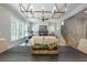 Open-concept living room showcases a stylish fireplace, large windows and views from the dining area at 1702 Eastside Parc St, Atlanta, GA 30316