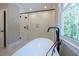 Modern main bathroom boasts a walk-in shower, soaking tub, and stylish fixtures, perfect for relaxation and rejuvenation at 1702 Eastside Parc St, Atlanta, GA 30316