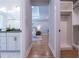View from hallway into the main bedroom with double sinks in the bath and walk-in closet at 1702 Eastside Parc St, Atlanta, GA 30316