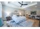 Spacious main bedroom features a tray ceiling, ceiling fan, sitting area, and a luxurious ensuite bathroom at 1702 Eastside Parc St, Atlanta, GA 30316