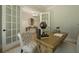 Well-lit office with French doors leading to the foyer, a desk, and sophisticated decor at 1702 Eastside Parc St, Atlanta, GA 30316