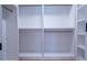 Customized walk-in closet providing optimal organization with built-in shelves, rods, and drawers for efficient storage at 1702 Eastside Parc St, Atlanta, GA 30316