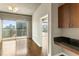 Balcony featuring city views, glass door access, and concrete ceiling details at 361 17Th Nw St # 1001, Atlanta, GA 30363