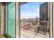 Balcony view featuring city skyline views, railing, and concrete exterior at 361 17Th Nw St # 1001, Atlanta, GA 30363