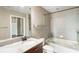 Bathroom with tub, tile and granite countertops at 361 17Th Nw St # 1001, Atlanta, GA 30363