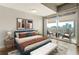 Bright bedroom with a large balcony offering city views, complemented by a comfortable queen bed and modern furnishings at 361 17Th Nw St # 1001, Atlanta, GA 30363