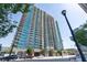 View of a luxury condominium building with floor-to-ceiling windows and balconies at 361 17Th Nw St # 1001, Atlanta, GA 30363
