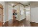 Condo foyer with hardwood floors, coat rack, and entry to the kitchen at 361 17Th Nw St # 1001, Atlanta, GA 30363