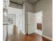 Hallway featuring wood floors, neutral paint and view of the bathroom and balcony at 361 17Th Nw St # 1001, Atlanta, GA 30363