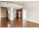 Open living area with hardwood flooring, concrete pillar, and stainless steel kitchen appliances at 361 17Th Nw St # 1001, Atlanta, GA 30363