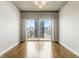 Modern living room with hardwood floors, and a sliding glass door to the balcony at 361 17Th Nw St # 1001, Atlanta, GA 30363