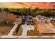 A high angle view of a neighborhood lot featuring a two-story home, a sprawling driveway, and lush landscaping at 159 Shadburn Ferry Rd, Buford, GA 30518