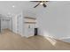 A bar area with under-counter refrigerator, wood shelves, sink and counterspace provides convenience at 159 Shadburn Ferry Rd, Buford, GA 30518