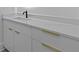 Bathroom vanity with white countertop and gold handles at 159 Shadburn Ferry Rd, Buford, GA 30518