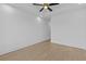 Spacious bedroom with hardwood floors, neutral walls, modern ceiling fan, and recessed lighting at 159 Shadburn Ferry Rd, Buford, GA 30518