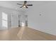 Bright, airy bedroom featuring hardwood floors, with access to an en-suite bathroom at 159 Shadburn Ferry Rd, Buford, GA 30518