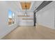 Dining Room with modern lighting, large windows, and hardwood floors at 159 Shadburn Ferry Rd, Buford, GA 30518
