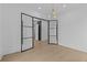 Contemporary entryway featuring modern glass doors and hardwood flooring at 159 Shadburn Ferry Rd, Buford, GA 30518