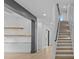 Open entryway with staircase and view to open living space with bar at 159 Shadburn Ferry Rd, Buford, GA 30518