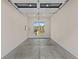 Clean garage featuring a concrete floor and view of the neighborhood at 159 Shadburn Ferry Rd, Buford, GA 30518