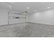 Spacious garage with a concrete floor and an automatic door at 159 Shadburn Ferry Rd, Buford, GA 30518