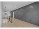 Upstairs hallway with accent wall and modern railing system at 159 Shadburn Ferry Rd, Buford, GA 30518