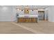 Kitchen with custom cabinets, large island, and hardwood floors at 159 Shadburn Ferry Rd, Buford, GA 30518