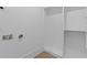 Bright laundry room with new connections and built-in shelving at 159 Shadburn Ferry Rd, Buford, GA 30518