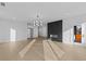 Open floor plan featuring hardwood flooring, a modern fireplace, and a sliding barn door at 159 Shadburn Ferry Rd, Buford, GA 30518