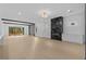 Bright living room with fireplace, modern lighting and sliding doors to backyard at 159 Shadburn Ferry Rd, Buford, GA 30518