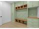 Well-organized mudroom with custom shelving and storage, plus a bench for convenience at 159 Shadburn Ferry Rd, Buford, GA 30518