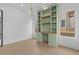 Bright office with a custom built-in desk, shelving, and ample storage at 159 Shadburn Ferry Rd, Buford, GA 30518
