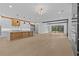 Open floor plan showcasing a modern kitchen with large island and spacious living area at 159 Shadburn Ferry Rd, Buford, GA 30518
