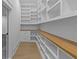 Spacious walk-in pantry with custom shelving and drawers for optimal storage at 159 Shadburn Ferry Rd, Buford, GA 30518