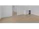 Bright room with light hardwood floors, crisp white trim, and a built-in beverage cooler at 159 Shadburn Ferry Rd, Buford, GA 30518