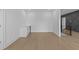 Bright room with light hardwood floors, crisp white trim, and a built-in beverage cooler at 159 Shadburn Ferry Rd, Buford, GA 30518