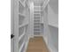 Spacious walk-in closet with ample shelving for organized storage at 159 Shadburn Ferry Rd, Buford, GA 30518