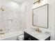 Bathroom features a tub, a marble countertop, and gold-colored fixtures at 2611 Charlesgate Ave, Decatur, GA 30030