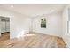 Bright bedroom with light hardwood floors, neutral walls and large windows bringing lots of light at 2611 Charlesgate Ave, Decatur, GA 30030
