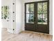 Elegant entryway featuring hardwood floors and glass paneled double doors letting in natural light at 2611 Charlesgate Ave, Decatur, GA 30030