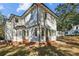 Stunning rear exterior of a two-story home with white siding and brick accents at 2611 Charlesgate Ave, Decatur, GA 30030