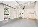 Well-organized garage with epoxy floors, built-in shelving, and storage cabinets at 2611 Charlesgate Ave, Decatur, GA 30030
