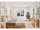 Bright bedroom with hardwood floors, a large window, and a stylish dresser for ample storage at 2611 Charlesgate Ave, Decatur, GA 30030