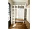 Charming mudroom with built-in cubbies, a bench, and hardwood floors at 2611 Charlesgate Ave, Decatur, GA 30030