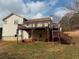 Backyard with an expansive deck and stairs for seamless outdoor enjoyment at 413 Kenny Ln, Temple, GA 30179