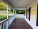 Relaxing covered front porch featuring a classic porch swing at 413 Kenny Ln, Temple, GA 30179