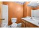 Bathroom featuring a toilet, vanity and a white tub at 2420 Green Rd, Loganville, GA 30052